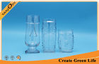 China 600ml Tiki Relief Clear Glass Beverage Bottles With Glass Stand factory