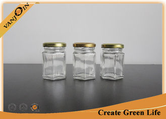 China Surface Handling 2oz 60ml Hexagonal Small Glass Food Jars With Lids / Lug Cap 43mm Dia supplier