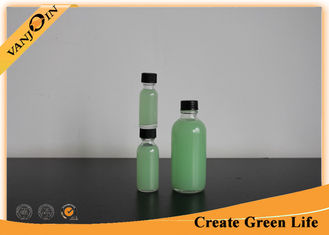China 2oz Boston Round Juice Glass Bottle , Glass Drinking Bottles With Screw Cap supplier