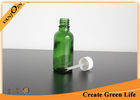 China Empty 30ml Green Essential Oil Glass Bottles Wholesale With Cap and Brush factory