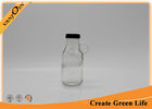 China Portable Square Shape Embossed 10oz Glass Juice Bottle With Handle factory